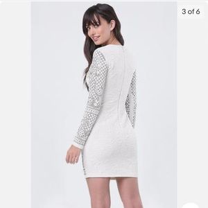 Beautiful bejeweled dress worn once. Nice fabric Size XL (12 14)